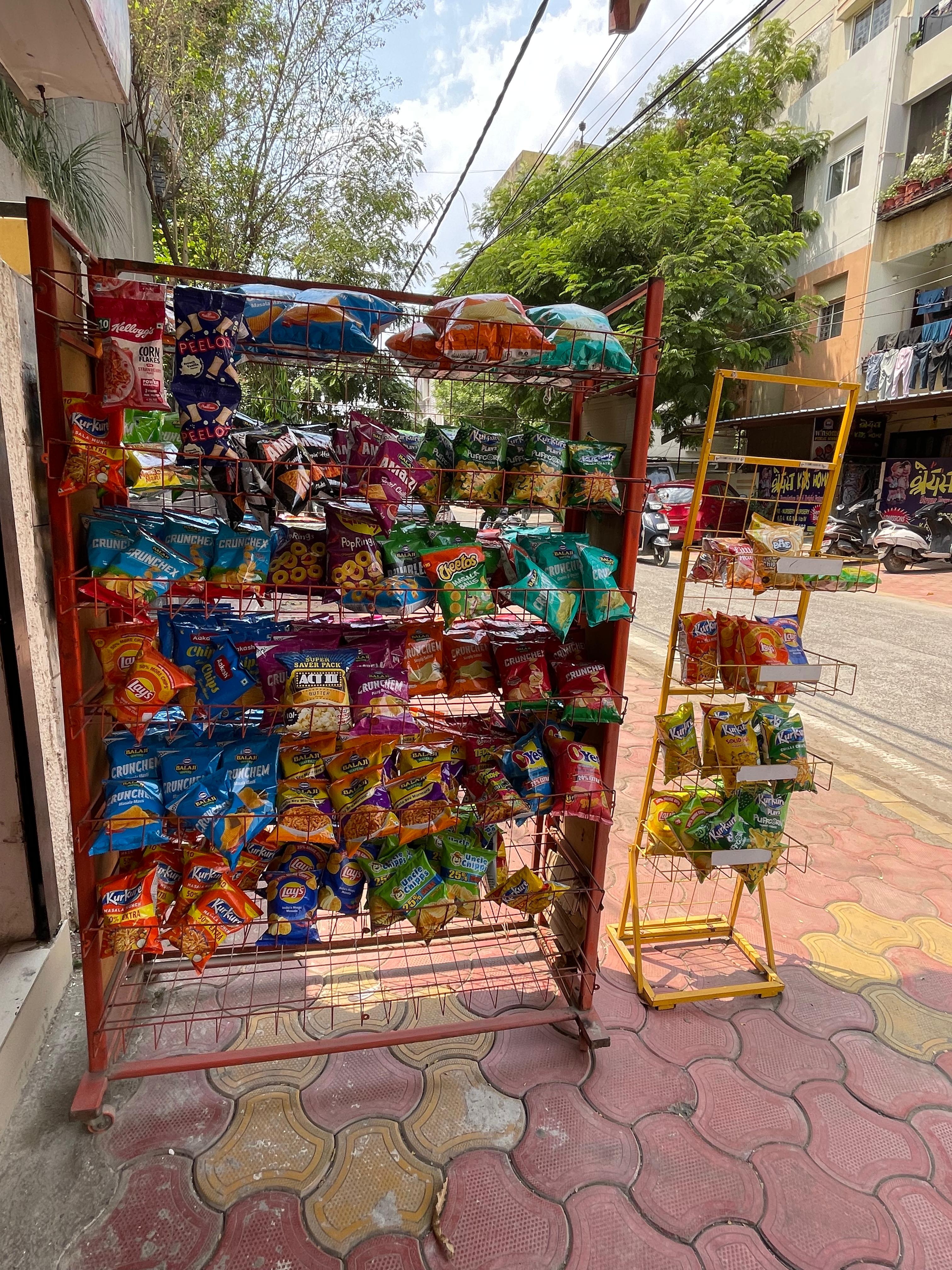 Inside Satnam Stores showing shelves and everyday products